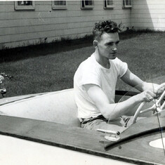 1950 - Tom and the boat he built