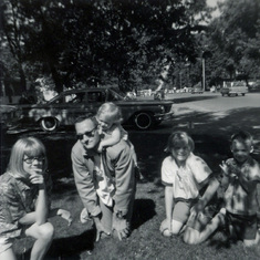 Tom with Peggy, Patty Rose, Colleen and Kevin, waiting for a parade on July 4, 1965