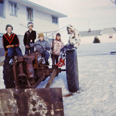 The kids loved to play on Tom's tractors (Jan. 1965)