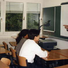 Tom "teaching" at American International School in Vienna. Rena knows the answer (1998)