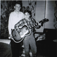 Tom's first guitar, Xmas, 1963. Pictured with brother, Tim.