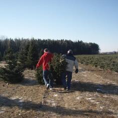 Josh and Tom carry out the tree for Xmas, 2009.