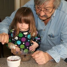 Papa was always on-hand for baking.  His primary job was to make sure that no one stepped off a chair while they were engrossed in the measuring, mixing and pouring.  Here, Papa teaches Charlotte how to spoon batter.