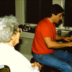 Gram Charlton teaches Tom how to play the piano using chords. Neither Tom nor Gram could read music but they both had "an ear" for it.