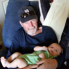Tom with new grandbaby Maxton
