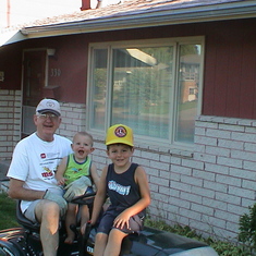 Gramps with his boys!  These are the two oldest grandsons who came to visit us in Wyoming, and loved to ride with gramps on the lawnmower.