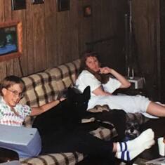 Travis and his dog with sister , Jenny , in the den at our home .