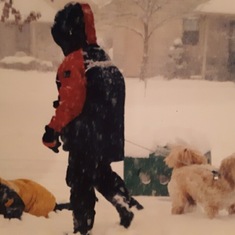 Trevor always loved to play in the snow with his older Brother John, and his dog snowball (AKA) Boy.