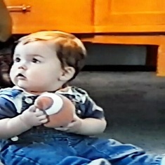 Trevor not even a year old and already knows to hold the football with two hands.