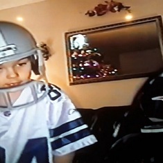 Trevor, and John sporting their Joey Galloway, and Tom Brady Jerseys along with the Cowboys and Patriots NFL Team helmets they got as gifts on Christmas Day.