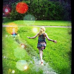 Trista playing in the puddles with Camara