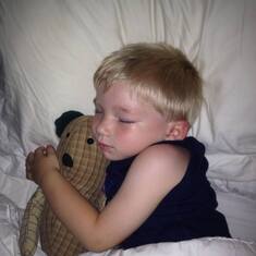 Aiden sleeps with Sissy's Bear every night.
