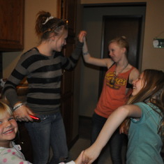Dani, Madi, Katrina, and Trista... dancing and making Christmas cookies.
