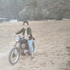 A glimpse of Trudy's wild side; riding a motorcycle circa mid 1950's