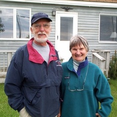 Tuck and Wayne in front of their house in Maine.