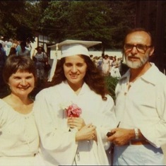 Tuck and Wayne with Suzanne at her high school graduation.