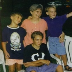 Tuck with three of her grandsons--Benjamin, Aaron, and Tyler.