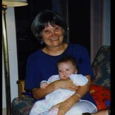 Tuck with Gwyneth, one of two newborn twins, 1997.