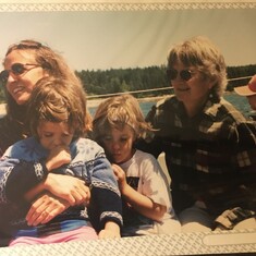 Suzanne and Tuck with Gwyne and Marina, her twin granddaughters, on the ferry in Maine. 2002.