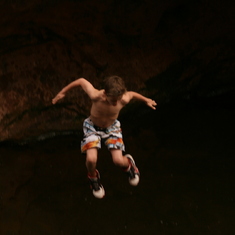 Tyler braving the narrow waterfall jump with his brothers and cousins.