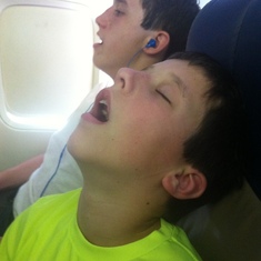 Tyler sleeping on the plane