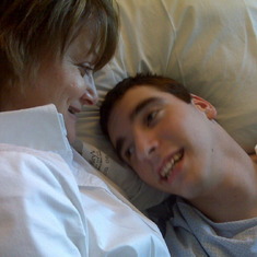 Tyler and I in his hosp bed during one of his many stays.  But as usual he's still happy!