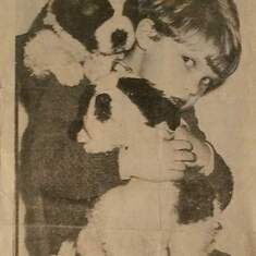 Ty as a young boy with the families puppies