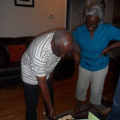 Cutting his 83rd birthday cake