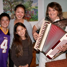 Vera entertaining the family with the accordion