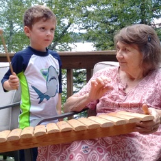 Making music with grandson Ruben on cabin deck