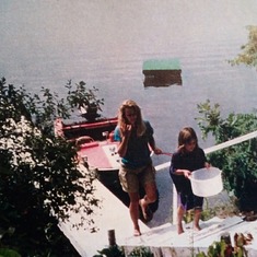 Lynn and Bryanna at Paddock Lake. That's Dad's motorboat. It was red and white, like his first car.