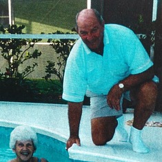 With sister, Betty, by his pool.