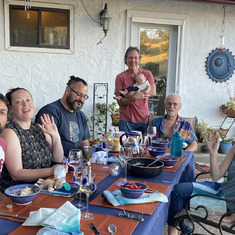 Family gathering on the patio in May, 2021 Left to right: Jared Smith, Lauren Smith, Travis Hance, Jay Smith with Lily, Vic, and Annie O'Kelley