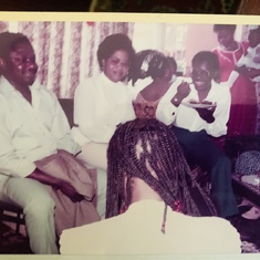 At one of our Hse parties in the 1980s - Mr Nkadi, Mrs Okonji, Vickie(eating), Flo in red, standg