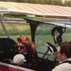 Chip giving Vikki a turn to pilot one of the Cessna planes he loved to fly.