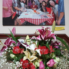 Flowers from the office with a family portrait in the background