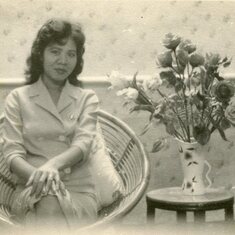 Mom - aged 23 with flowers her favourite item to pose with