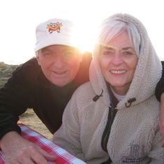 Ginny and Doug at Pebble Beach (with a bottle of chardonnay)