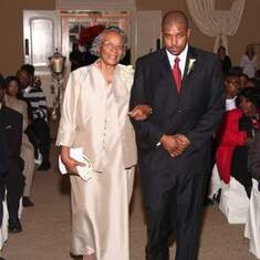 Grandmother being escorted by her grandson Sean at her granddaughter Amy's wedding.