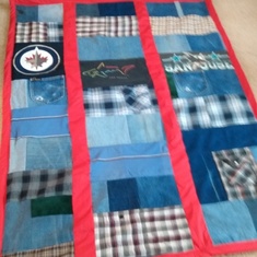 Blankets made by Lorraine out of Walters denim jeans, even the pockets, sports logo tees, and plaid shirts for their three kids.