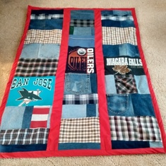 Blankets made by Lorraine out of Walters jeans , tees, Plaid shirts , sports logo tees and denim jeans for their three kids.