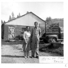 Walt & Martha in the driveway at Elk in 1957.  Milk house is in the background, the pick-up was a 1954 Ford (I think), and the low structure on their left was the water well.