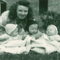 Mom Poses with Her Three Children