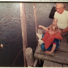 Dad helping Brynne catch her first fish-Lake Minnetonka