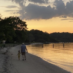 Hallie and Papa walking on the beach by the harbor. Papa’s favorite place Aug. 2020