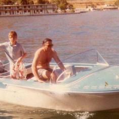 My dad driving a boat owned by my Uncle Dennis in Lake Chelan.  I'm handling the water ski ropes in the back.