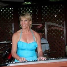 playing piano with the band at our annual summer bash party