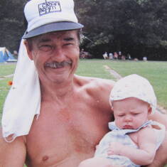 Wesley post-race holding Hoyt Jr. (1 and ½ months old), June 1989.