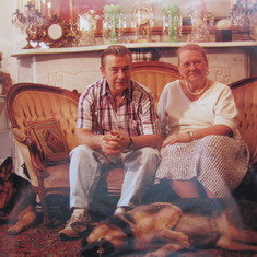 Wesley and Ellen with their German shepherds, Otto and Sinka, in the shop.