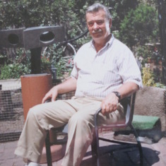 Wesley outside on their backyard patio in the ‘80s.